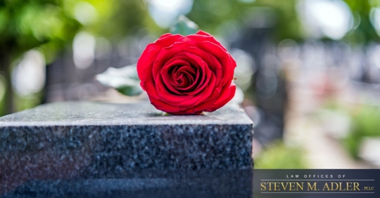 Rose on top of grave
