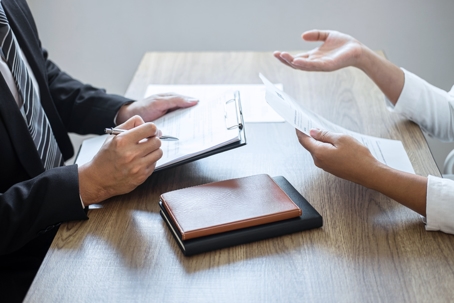 People talking about paperwork