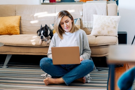 Woman looking into estate planning while on her laptop